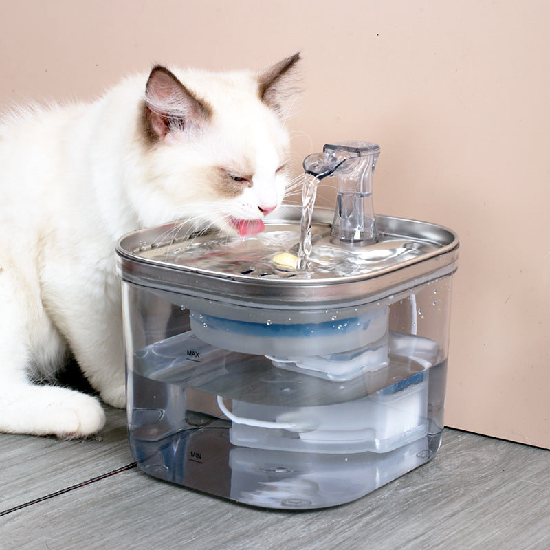 White cat drinking from the MewSip fountain
